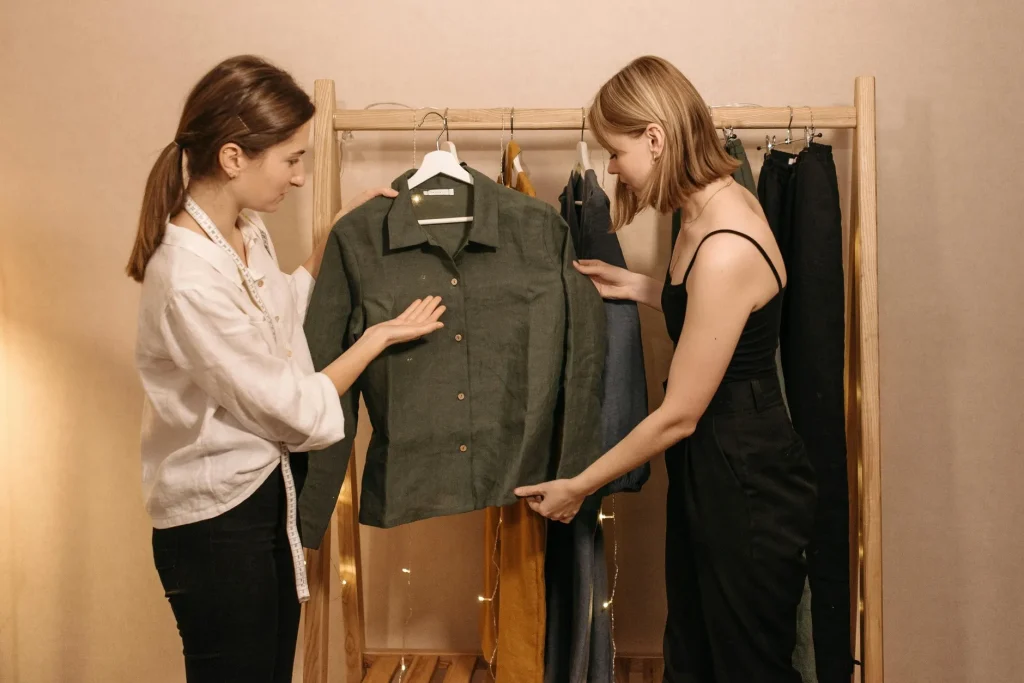 women checking clothing inside the wardrobe