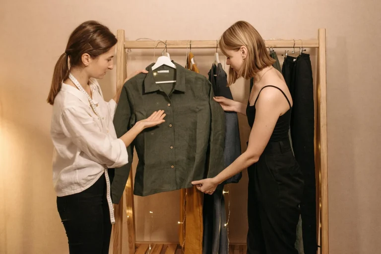 women checking clothing inside the wardrobe
